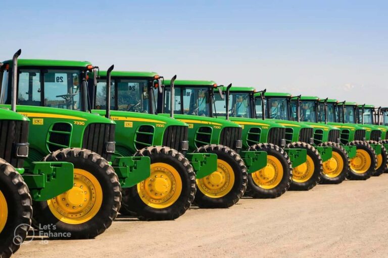 Row of green tractors with yellow wheels