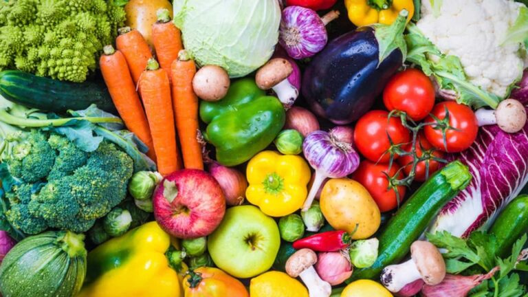 Assorted fresh fruits and vegetables arranged together