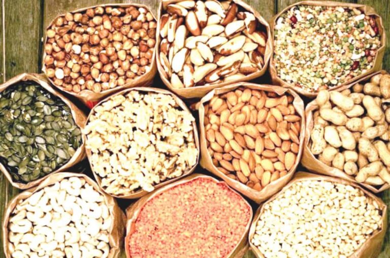 Assorted nuts, seeds and lentils in paper bags