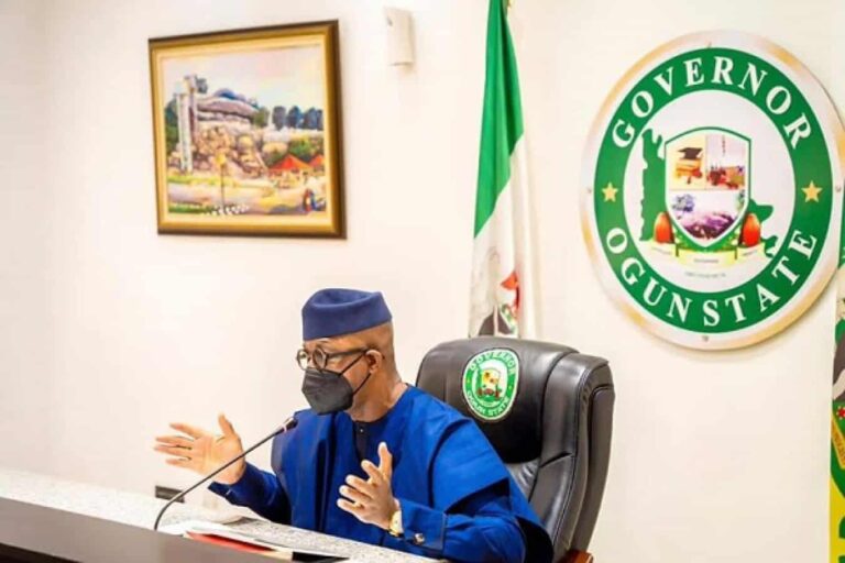 Governor speaking at desk with Ogun State seal