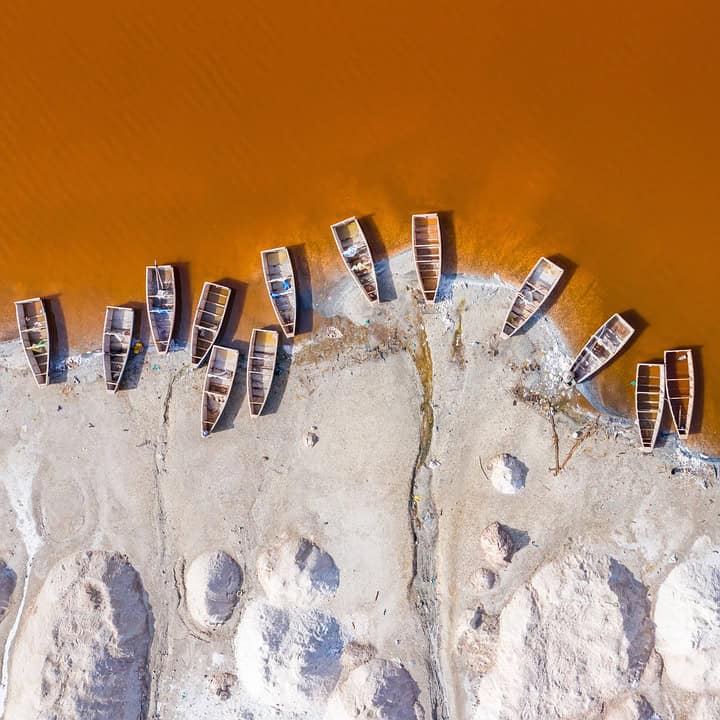 Aerial view of wooden boats on sandy shore