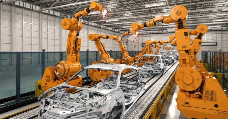 Robotic arms assembling car bodies on production line