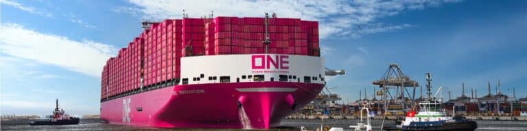 Pink ONE container ship at busy port