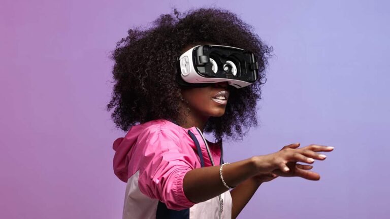 Woman wearing virtual reality headset reaching forward