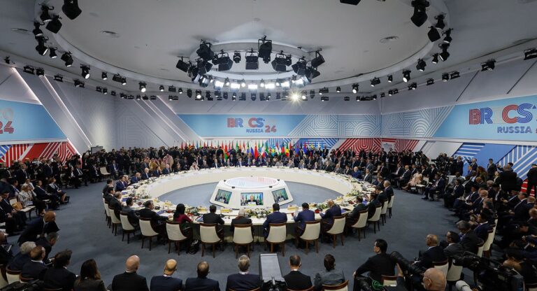 International summit with leaders seated at circular table