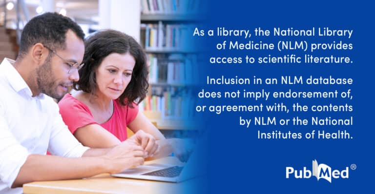 Two adults using laptop with NLM disclaimer text
